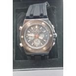 Boxed Michael Philippe mens wristwatch with black dial on black rubber strap. P&P Group 1 (£14+VAT