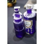 Three vintage blue ribbed pharmacy poison bottles, tallest H: 22 cm. P&P Group 2 (£18+VAT for the