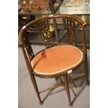 An Edwardian inlaid mahogany parlour chair with oval upholstered seat and curved back rail. Not