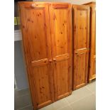Modern pine triple door wardrobe, 183 x 130 x 58 cm, and a similar modern pine two door wardrobe,