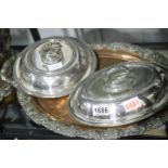 Large quantity of silver plate, comprising two large trays, two covered entree dishes, hot water