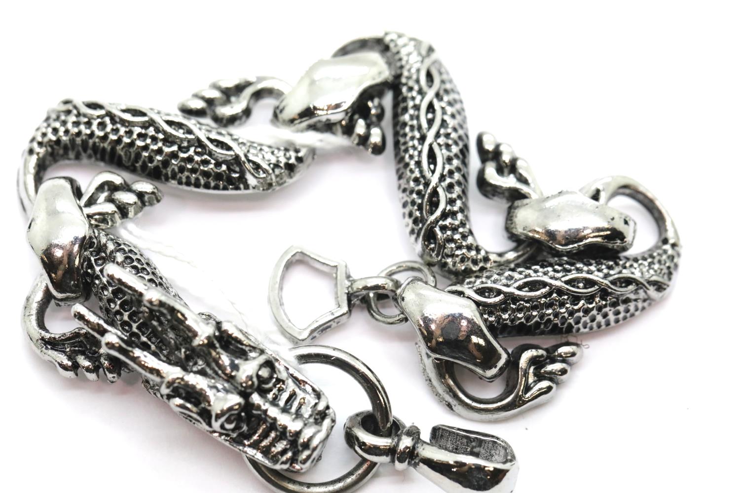 White metal Tibetan silver linked dragon bracelet, 34g. P&P Group 1 (£14+VAT for the first lot