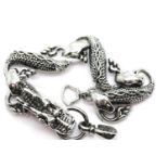White metal Tibetan silver linked dragon bracelet, 34g. P&P Group 1 (£14+VAT for the first lot