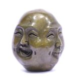 Small Oriental four face Buddha head with impressed seal mark to base. P&P Group 1 (£14+VAT for