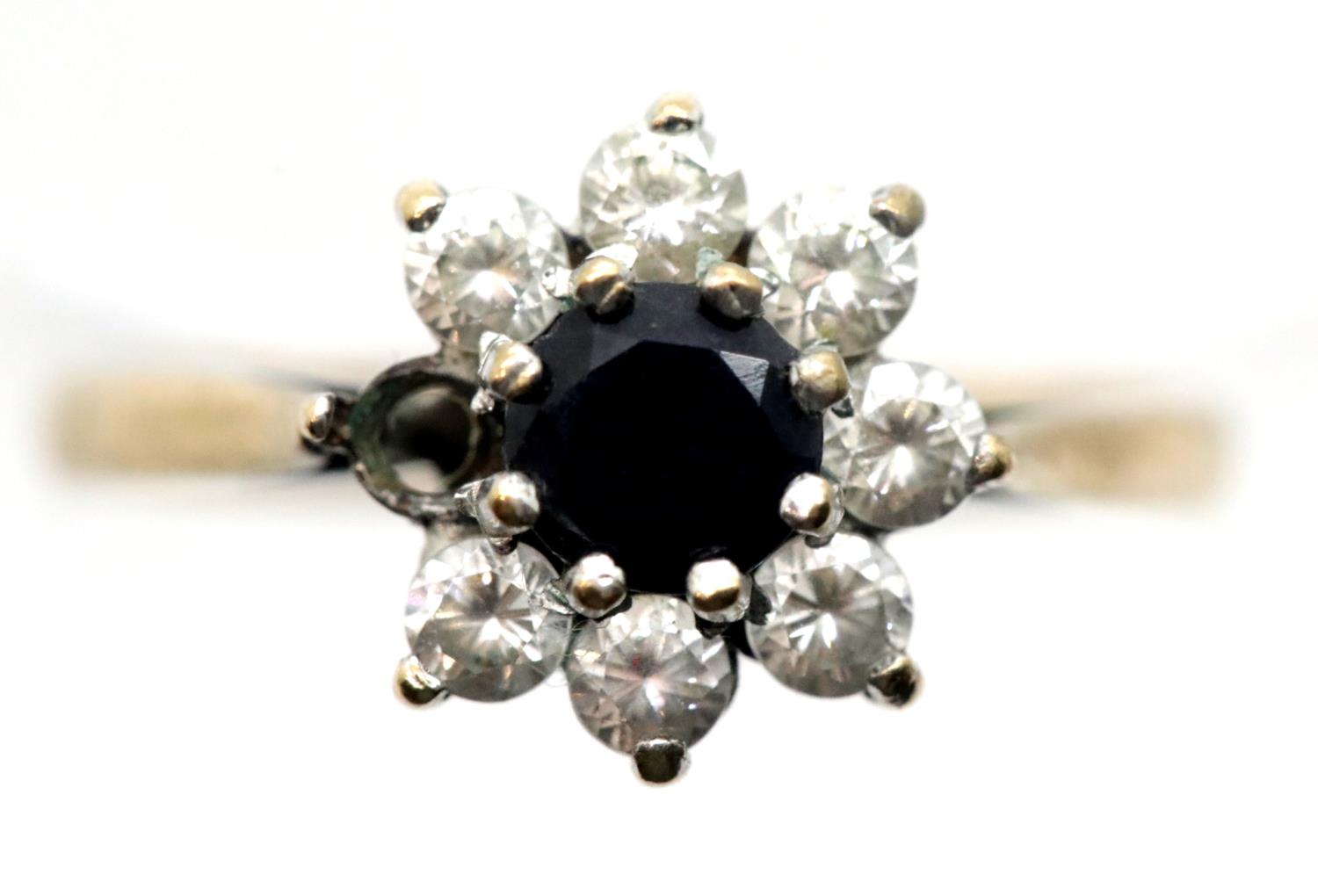 9ct gold sapphire and CZ set flower head ring, one stone missing, size N/O, 2.3g. P&P Group 1 (£14+