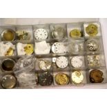 Box of pocket watch faces and movements. P&P Group 3 (£25+VAT for the first lot and £5+VAT for