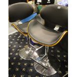 Pair of contemporary Eames style bentwood and black leather height adjustable kitchen stools. This