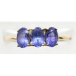 9ct gold blue tourmaline three stone ring, size O, 2.1g. P&P Group 1 (£14+VAT for the first lot