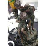 Contemporary bronze effect figural table lamp, depicting a young boy and girl fishing, with a
