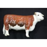 Beswick glazed ceramic Hereford cow marked CH of Champions, L: 17 cm. P&P Group 1 (£14+VAT for the