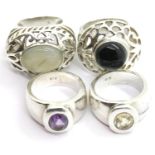 Four silver designer rings, mixed sizes, 64g total. P&P Group 1 (£14+VAT for the first lot and £1+