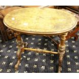 19th century inlaid walnut oval occasional table, having turned and carved supports and stretcher.