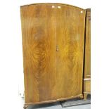 20th century mahogany two door wardrobe, having quartered veneer and cross banding. Not available