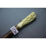 Antique carved Oriental bone and hardwood walking stick. P&P Group 3 (£25+VAT for the first lot