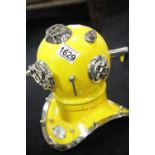 Yellow metal divers helmet, H: 23 cm. P&P Group 3 (£25+VAT for the first lot and £5+VAT for