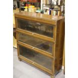 Three shelf Globe Wernicke type bookcase in walnut, 90 x 30 x 100 cm H. Not available for in-house