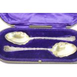 Cased hallmarked pair of spoons, Sheffield assay, maker Walker and Hall, 172g. P&P Group 2 (£18+