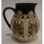 Moorcroft Tengu Owl jug, H: 14 cm. P&P Group 2 (£18+VAT for the first lot and £3+VAT for