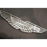 Chrome Aston Martin wall plaque, W: 33 cm. P&P Group 3 (£25+VAT for the first lot and £5+VAT for