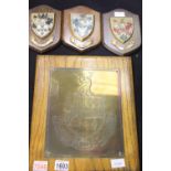 A large engraved brass plaque bearing coat of arms, the motto "Fear God and Fear Nought" mounted