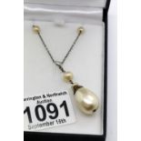 Boxed baroque pearl pendant on a silver chain. P&P Group 1 (£14+VAT for the first lot and £1+VAT for