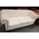 New display model buttoned back three seater Chesterfield settee, L: 196 cm. Not available for in-