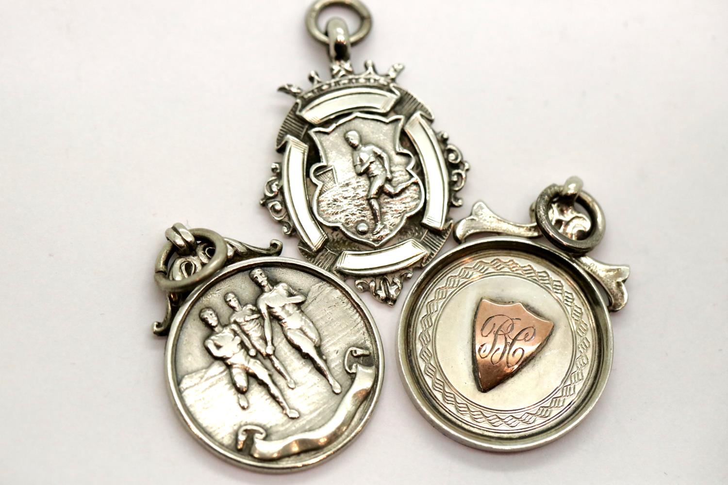 Three hallmarked silver fobs, 25g. P&P Group 1 (£14+VAT for the first lot and £1+VAT for