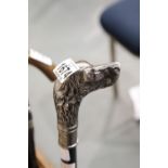 Dogs head metal walking stick, H: 90 cm. Not available for in-house P&P.