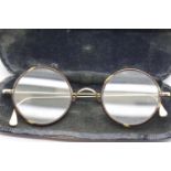 Pair of unmarked yellow metal (possibly gold) and tortoiseshell rimmed circular glasses with