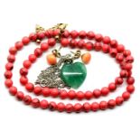 Coral necklace and earrings and a jade pendant. P&P Group 1 (£14+VAT for the first lot and £1+VAT