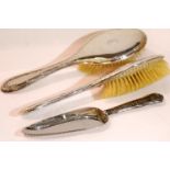 Two silver brushes and a hallmarked silver handled knife, total weight 355g. P&P Group 2 (£18+VAT