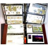 Two albums of first day covers, mint stamps (2x high value sets) and stamp books. P&P Group 2 (£18+