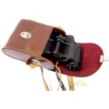 Carl Zeiss Jenoptem 8 x 30 binoculars in leather case. P&P Group 2 (£18+VAT for the first lot and £