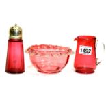 Cranberry glass sugar bowl and milk jug and a cranberry glass sugar castor. P&P Group 3 (£25+VAT for