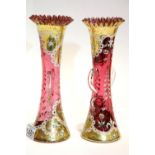 Pair of Bohemian red and gold vases, floral design with frill top and handles, H; 25 cm. Not