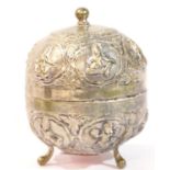 Middle Eastern presumed silver relief decorated spherical pot and cover, raised on three supports,