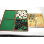 Folding inlaid rosewood chess board with pieces within, complete, plus another smaller chess set.