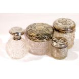 Four silver topped glass dressing table pots. P&P Group 3 (£25+VAT for the first lot and £5+VAT