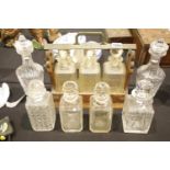 Three bottle tantalus and other glass decanters, H: 22 cm, including stoppers. Not available for