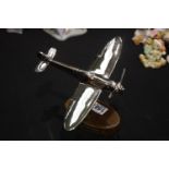 Chrome Spitfire on wooden base, H: 32 cm. P&P Group 2 (£18+VAT for the first lot and £3+VAT for