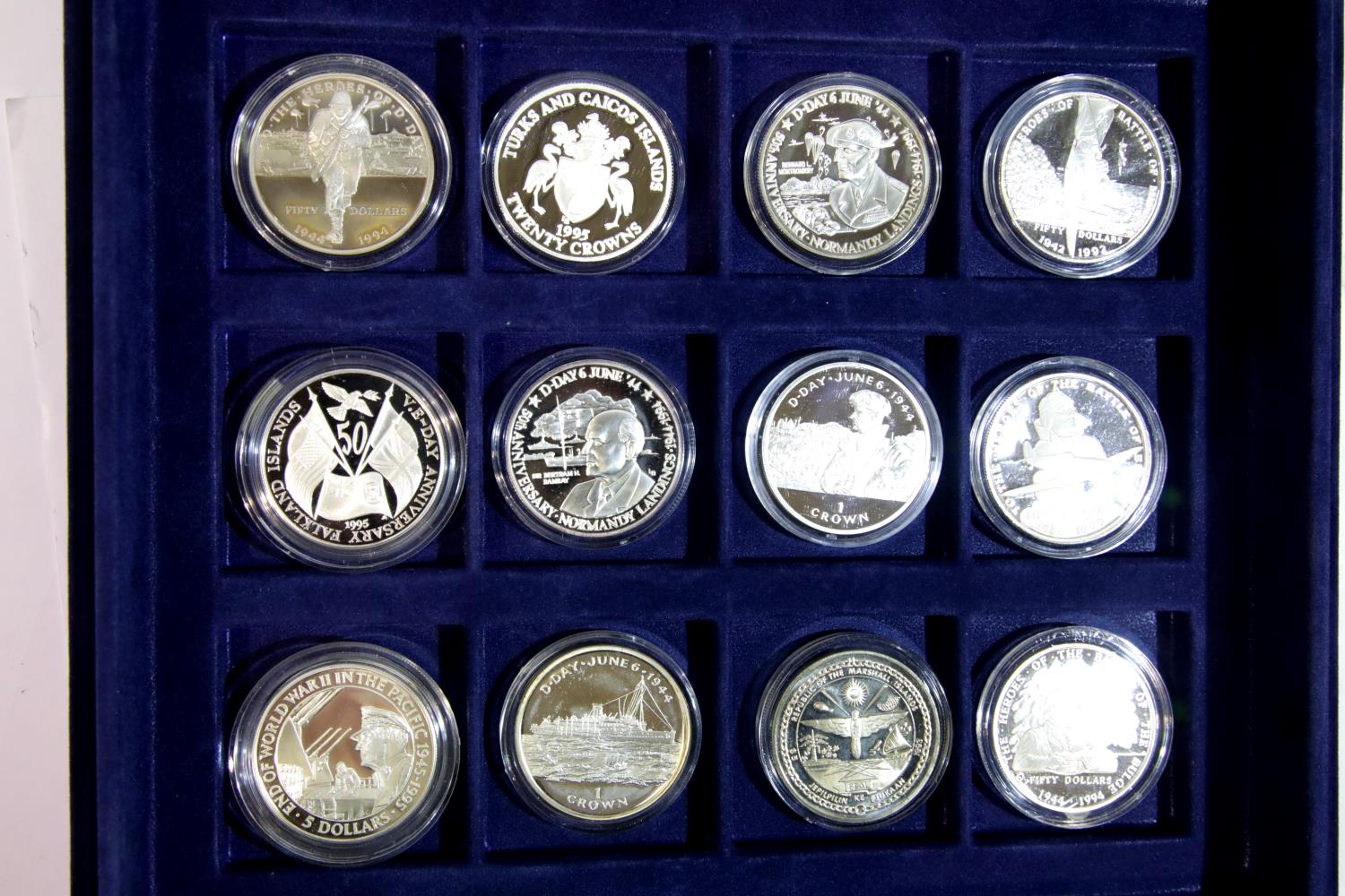 Twelve World at War silver proof coins. P&P Group 1 (£14+VAT for the first lot and £1+VAT for