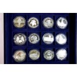 Twelve World at War silver proof coins. P&P Group 1 (£14+VAT for the first lot and £1+VAT for