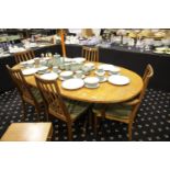 G-Plan extending oval dining table with folding leaf, with a set of five (3+2) chairs. Not available