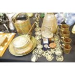 19th century brass and copper, including a large pitcher, graduated measuring cups, horse brasses