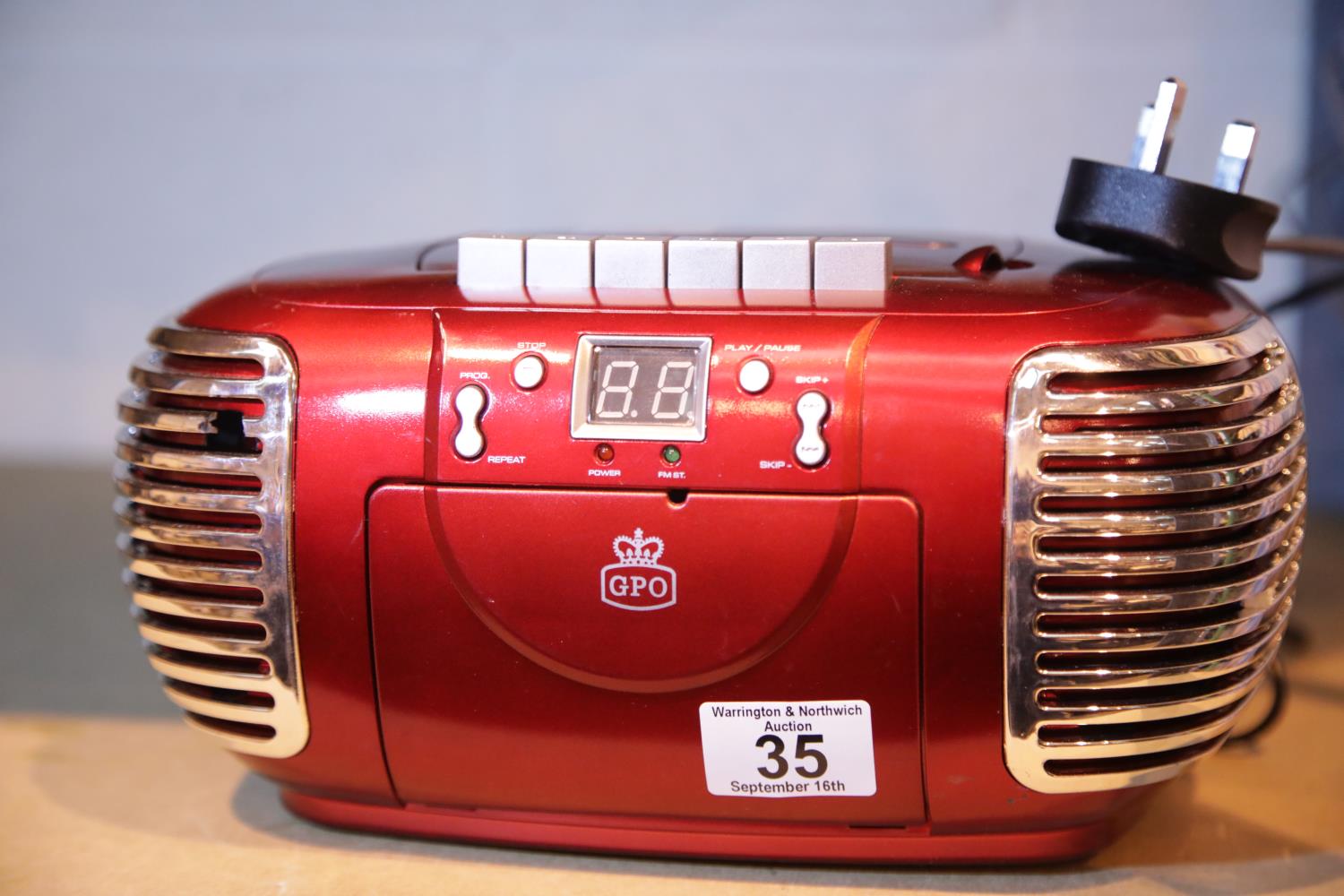 Red GPO PCD299 a 3-in-1 FM/AM Radio, CD and Cassette player with power cable. Not available for in-