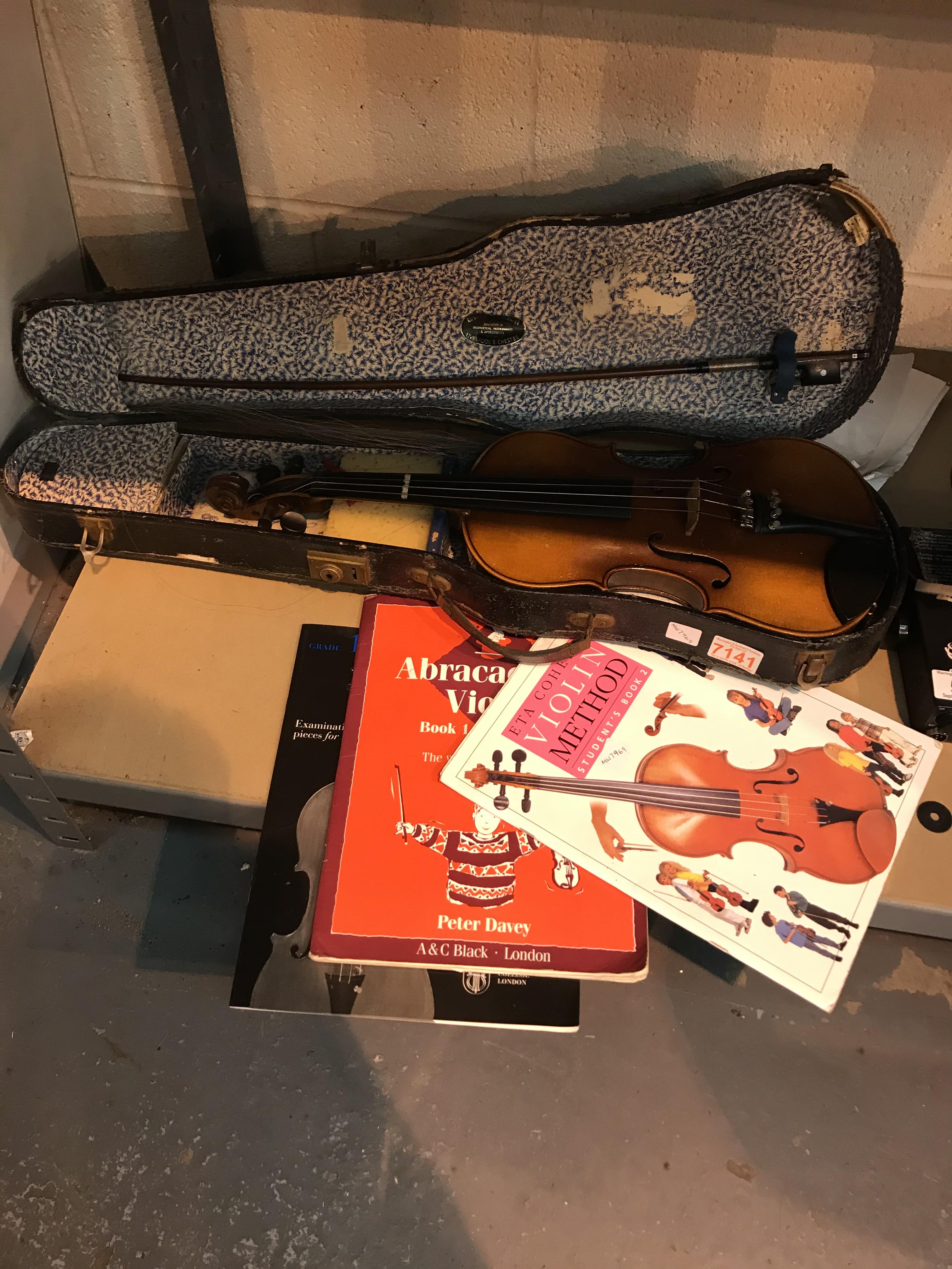 Childs violin with three lesson books. Not available for in-house P&P