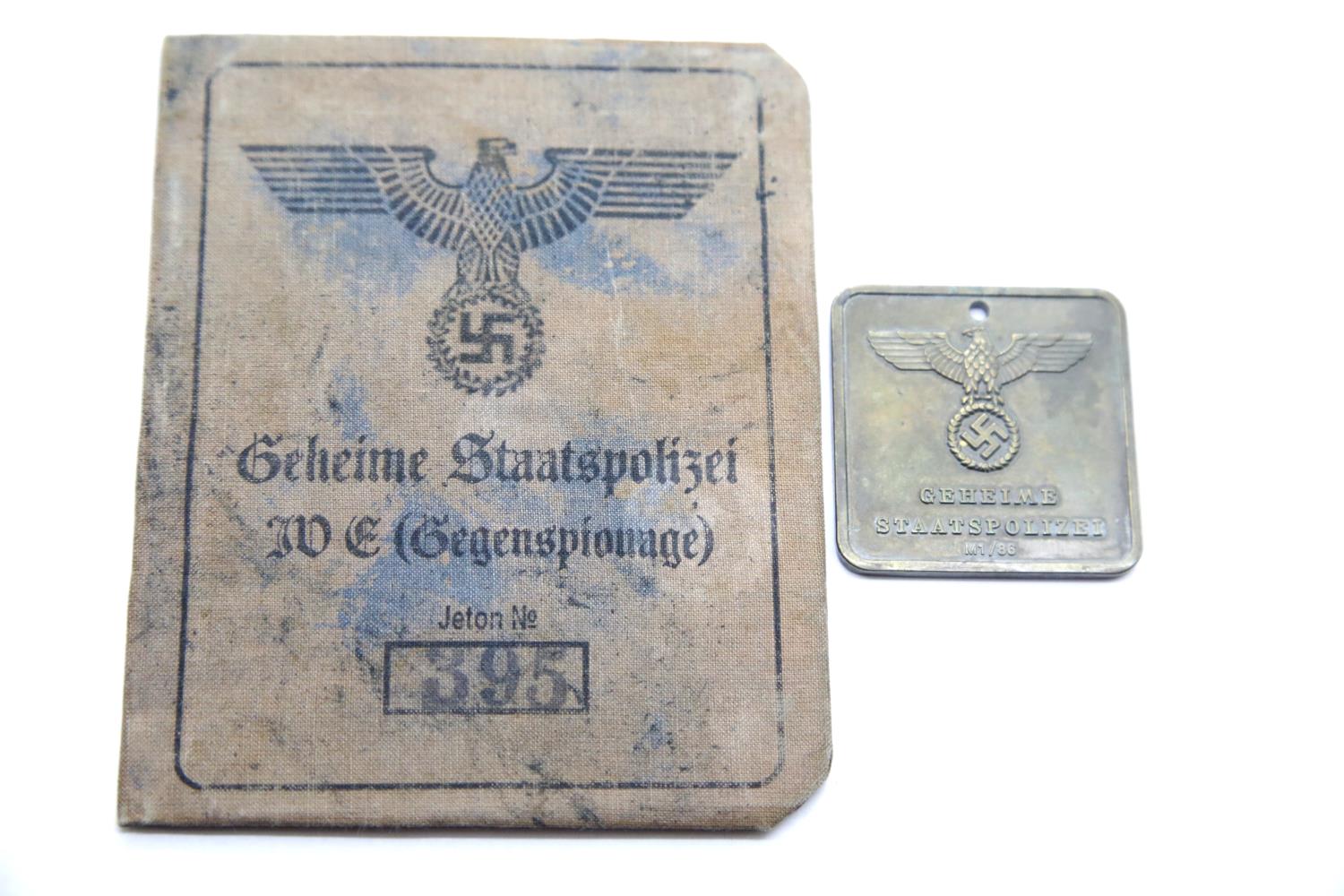 German SS type Gestapo brass tag and canvas covered identity book. P&P Group 1 (£14+VAT for the
