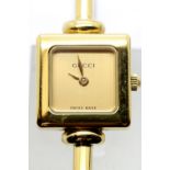 Ladies gold plated Gucci cocktail watch with champagne dial. P&P Group 1 (£14+VAT for the first