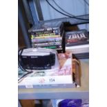 Selection of various DVDs and a digital clock radio. Not available for in-house P&P. Condition