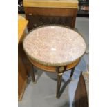 Antique French marble top circular table with brass gallery, ormolu mounts and painted frieze,
